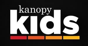 Logo for Kanopy Kids with white text and a multicolored bar underneath.
