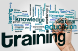 training1 Word cloud with training as the largest word, surrounded by terms like knowledge, learning, education, workshop, seminar, and a hand holding a marker.